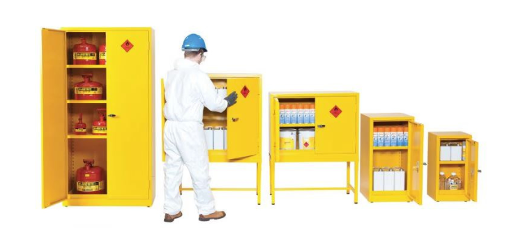 Image of several COSHH Cabinets in different sizes storiing different products & Chemicals. A man is inspecting the cabinets.
