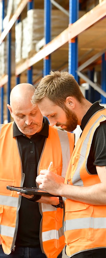 Warehouse designers working on a tablet